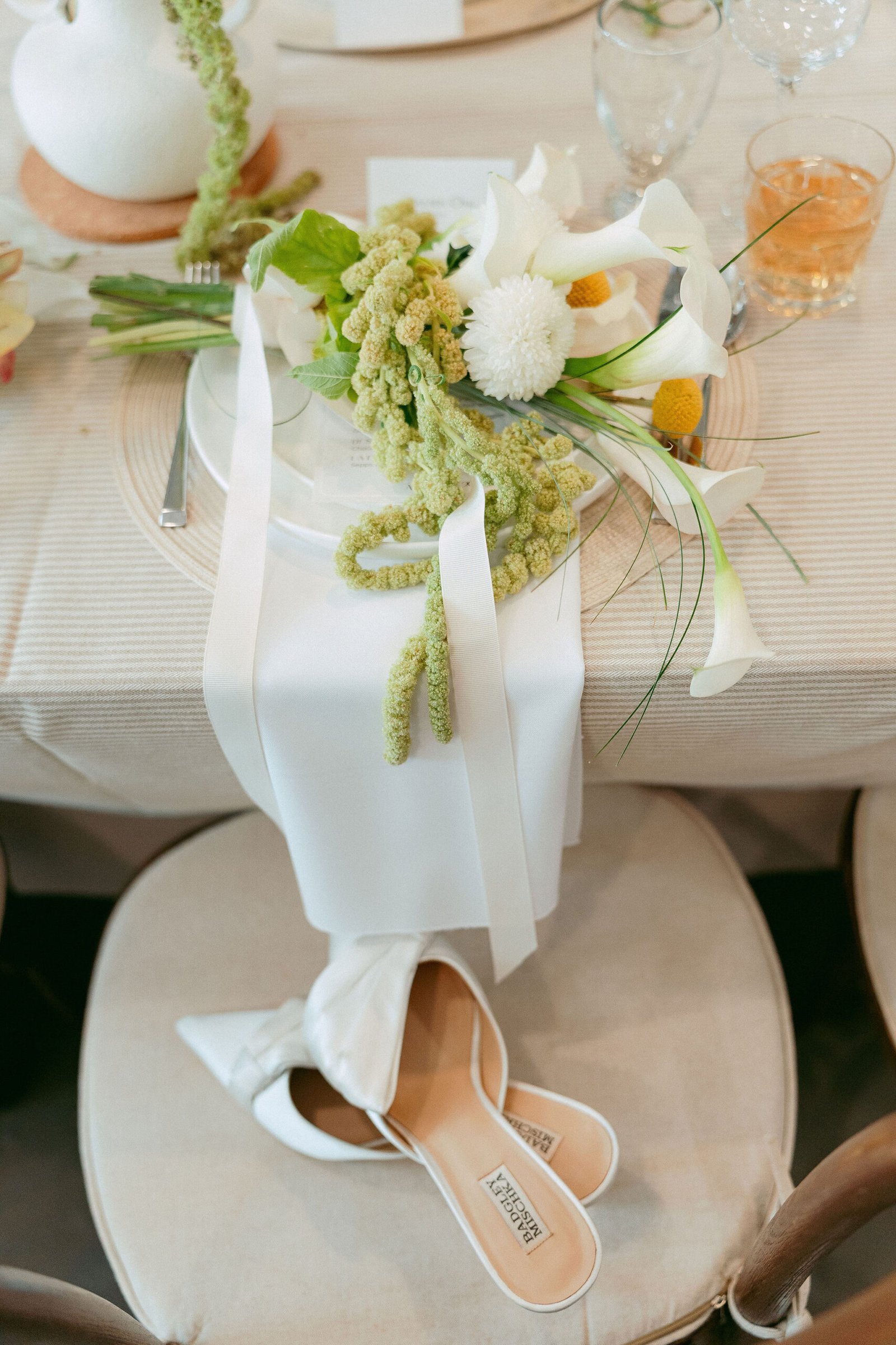 DIY wedding table setting with white flowers and yellow Billy Balls.