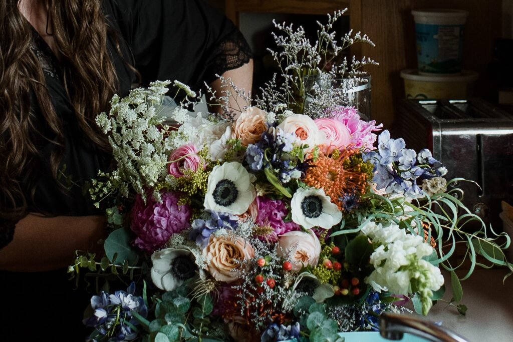 wildflower bouquet made by a bride bouquet with anemone and wild flowers