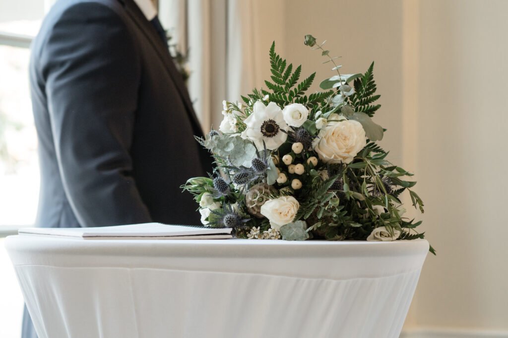 black saddle photography wedding muskoka k+j anemone bouquet sitting on a table